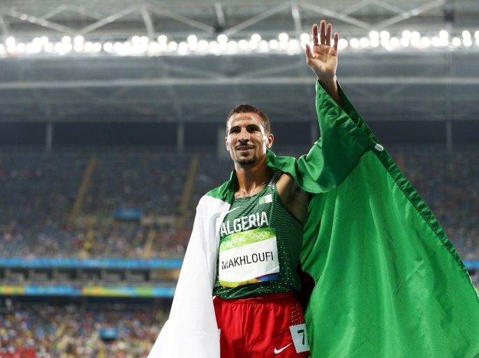 RIO DE JANEIRO, BRAZIL - AUGUST 20: Taoufik Makhloufi of Algeria celebrates after winning silver in the Men's 1500 meter Final on Day 15 of the Rio 2016 Olympic Games at the Olympic Stadium on August 20, 2016 in Rio de Janeiro, Brazil. (Photo by Patrick Smith/Getty Images)