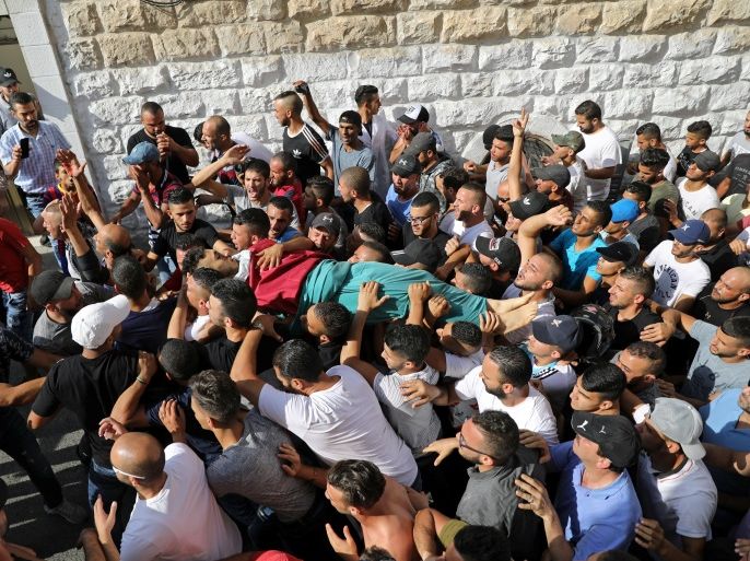 ATTENTION EDITORS - VISUAL COVERAGE OF SCENES OF INJURY OR DEATH Mourners carry the body of Palestinian Mohammad Abu Ghannam during his funeral in the East Jerusalem neighbourhood of A-tur July 21, 2017. REUTERS/Ammar Awad