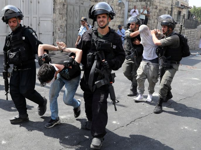 Israeli security forces arrest Palestinian men following clashes outside Jerusalem's Old city July 21, 2017. REUTERS/Ammar Awad