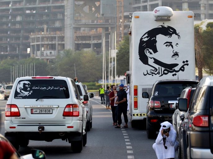 A painting depicting Qatar’s Emir Sheikh Tamim Bin Hamad Al-Thani is seen on a bus during a demonstration in support of him in Doha, Qatar June 11, 2017. REUTERS/Naseem Zeitoon