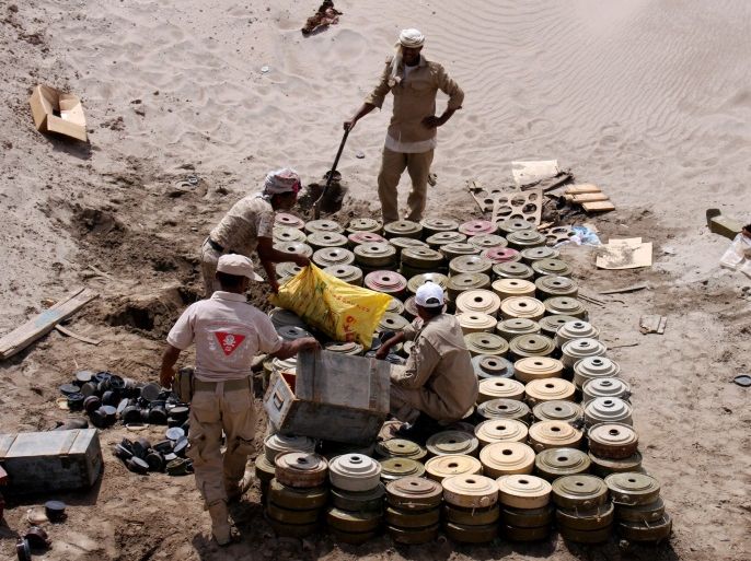 Members of a Yemeni military demining unit prepare to destroy unexploded bombs and mines collected from conflict areas near the southern port city of Aden, Yemen August 1, 2017. REUTERS/Fawaz Salman
