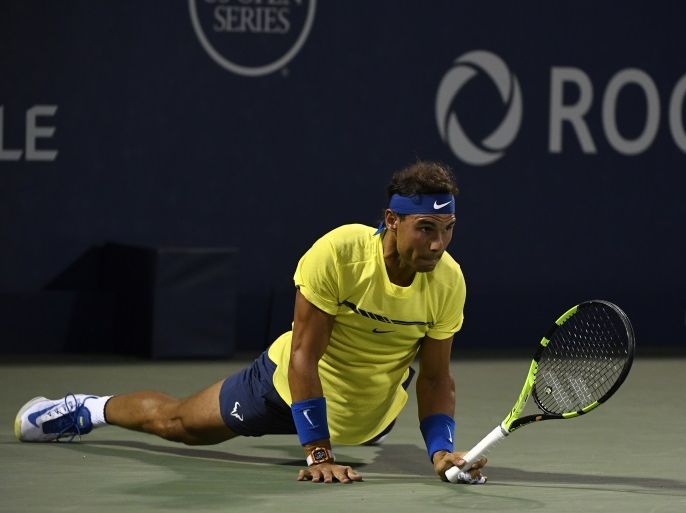 Aug 10, 2017; Montreal, Quebec, Canada; Rafael Nadal of Spain falls during his match against Denis Shapovalov of Canada (not pictured) during the Rogers Cup tennis tournament at Uniprix Stadium. Mandatory Credit: Eric Bolte-USA TODAY Sports