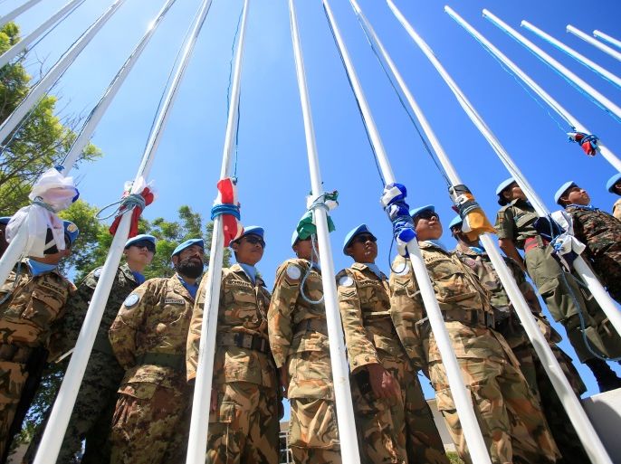 Peacekeepers of the United Nations Interim Force in Lebanon (UNIFIL) stand stand next to their folded flags during a handover ceremony from Italian Major-General Luciano Portolano to Irish Major-General Michael Bearyover the command of Lebanon's U.N. peacekeeping forces at the United Nations headquarters in Naqoura, southern Lebanon, July 19, 2016. REUTERS/Ali Hashisho TPX IMAGES OF THE DAY
