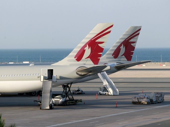 Qatar Airways aircrafts are seen at Hamad International Airport in Doha, Qatar June 12, 2017. REUTERS/Naseem Zeitoon