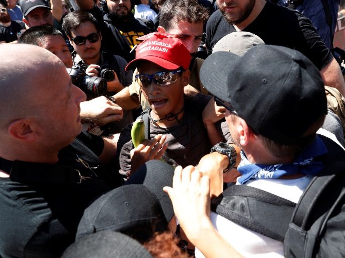 Sam Hyde, a supporter of U.S. President Donald Trump (C), is being surrounded by counter-demonstrators during the cancelled No Marxism in America rally in Berkeley, California, U.S. August 27, 2017. REUTERS/Stephen Lam