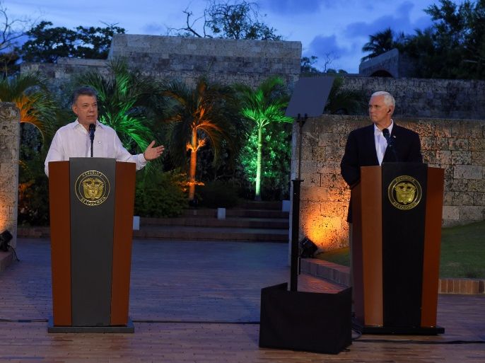Colombia's President Juan Manuel Santos and U.S. Vice President Mike Pence during a press conference in Cartagena, Colombia August 13, 2017. Colombian Presidency/Handout via REUTERS ATTENTION EDITORS - THIS IMAGE HAS BEEN SUPPLIED BY A THIRD PARTY.