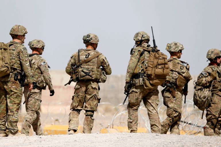 U.S. troops walk outside their base in Uruzgan province, Afghanistan July 7, 2017.  REUTERS/Omar Sobhani          TPX IMAGES OF THE DAY