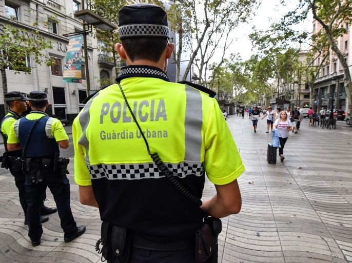 Police officers stand guard on the Las Ramblas boulevard in Barcelona on August 19, 2017, two days after a van ploughed into the crowd, killing 13 persons and injuring over 100.Drivers have ploughed on August 17, 2017 into pedestrians in two quick-succession, separate attacks in Barcelona and another popular Spanish seaside city, leaving 14 people dead and injuring more than 100 others. / AFP PHOTO / Pascal GUYOT (Photo credit should read PASCAL GUYOT/AFP/Getty Images)