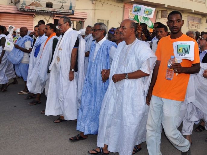 Mauritanian opposition leaders, among them Sidi Mohamed Ould Mohamed Vall (front row, 4L) of the Republican Party for Democracy and Renewal (PRDR), take part in a protest march against the country's new constitution on October 29, 2016 in Nouakchott. / AFP / - (Photo credit should read -/AFP/Getty Images)