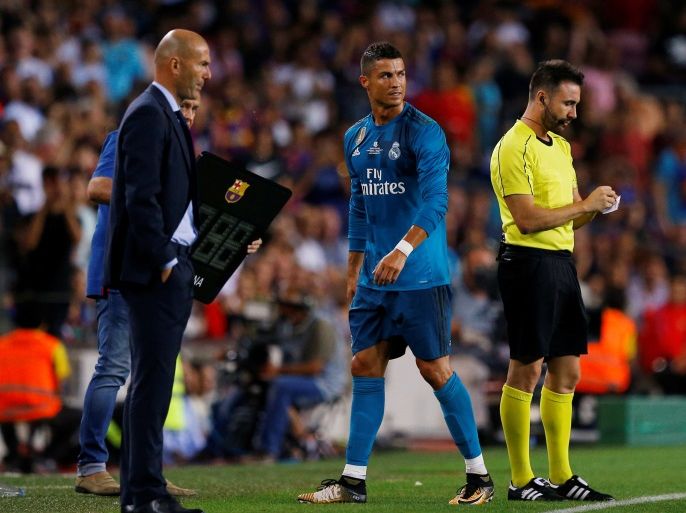 Soccer Football - Barcelona v Real Madrid Spanish Super Cup First Leg - Barcelona, Spain - August 13, 2017 Real Madrid’s Cristiano Ronaldo walks off dejected past coach Zinedine Zidane after being sent off REUTERS/Juan Medina