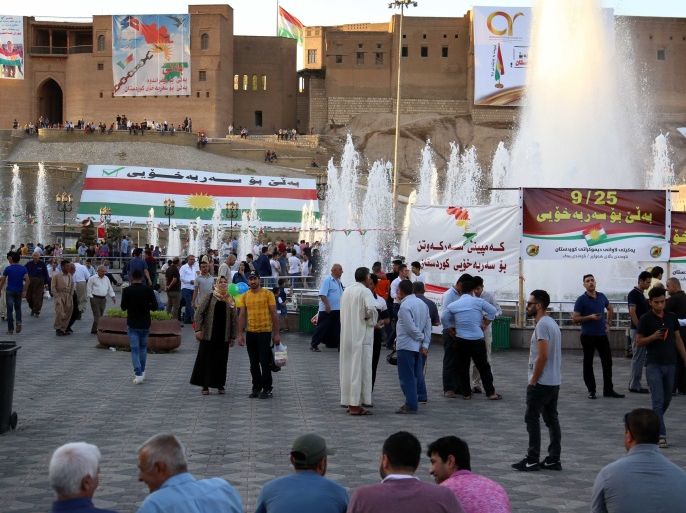 Iraqis walk in a square in the citadel in Arbil, the capital of the autonomous Kurdish region of northern Iraq, on September 23, 2017.Iraqi Kurdish leader Massud Barzani insisted that a controversial September 25 independence referendum for his autonomous Kurdish region in northern Iraq will go ahead, even as last-minute negotiations aimed to change his mind. / AFP PHOTO / SAFIN HAMED (Photo credit should read SAFIN HAMED/AFP/Getty Images)