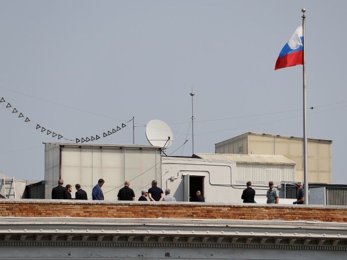 People are seen on the rooftop at the Consulate General of Russia in San Francisco, California, U.S., September 2, 2017. REUTERS/Stephen Lam