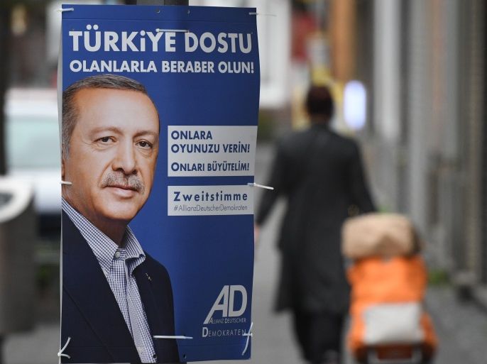 Picture taken on September 7, 2017 shows an election campaign poster of the 'Alliance of German Democrats' (ADD) party depicting Turkish President Recep Tayyip Erdogan in Cologne, western Germany.The text reads 'Friends of Turkey - stand with them! Vote for them! Grow with them!'. The posters offer a clue to which alternatives Erdogan may have had in mind when he urged German Turks last month to vote against Merkel's conservatives and other 'enemies' of Turkey. / AFP PHOTO / dpa / Henning Kaiser / Germany OUT (Photo credit should read HENNING KAISER/AFP/Getty Images)