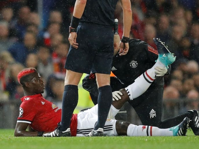 Soccer Football - Champions League - Manchester United vs FC Basel - Old Trafford, Manchester, Britain - September 12, 2017 Manchester United's Paul Pogba receives medical attention after sustaining an injury REUTERS/Darren Staples