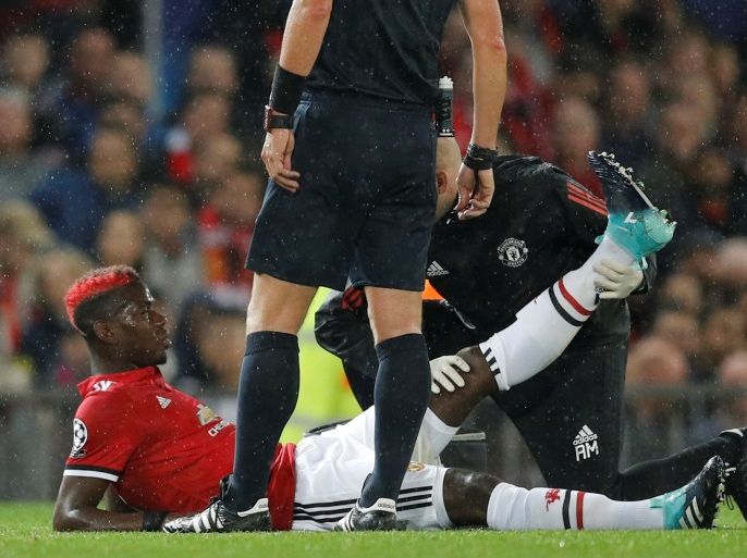Soccer Football - Champions League - Manchester United vs FC Basel - Old Trafford, Manchester, Britain - September 12, 2017 Manchester United's Paul Pogba receives medical attention after sustaining an injury Action Images via Reuters/Jason Cairnduff
