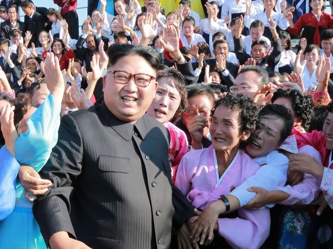 This undated picture released from North Korea's official Korean Central News Agency (KCNA) on September 12, 2017 shows North Korean leader Kim Jong-Un (C) attending a photo session with teachers who volunteered to work at branch schools on islands and schools in forefront line and mountainous areas, in Pyongyang. / AFP PHOTO / KCNA VIA KNS / STR / South Korea OUT / REPUBLIC OF KOREA OUT ---EDITORS NOTE--- RESTRICTED TO EDITORIAL USE - MANDATORY CREDIT 'AFP PHOTO/KCNA VIA KNS' - NO MARKETING NO ADVERTISING CAMPAIGNS - DISTRIBUTED AS A SERVICE TO CLIENTSTHIS PICTURE WAS MADE AVAILABLE BY A THIRD PARTY. AFP CAN NOT INDEPENDENTLY VERIFY THE AUTHENTICITY, LOCATION, DATE AND CONTENT OF THIS IMAGE. THIS PHOTO IS DISTRIBUTED EXACTLY AS RECEIVED BY AFP. / (Photo credit should read STR/AFP/Getty Images)