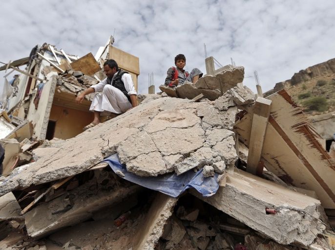 Yemenis react as they sit on the debris of a house hit in an air strike in the residential southern Faj Attan district of the capital, Sanaa, on August 25, 2017.The attack destroyed two buildings in the southern district, leaving people buried under debris, witnesses and medics said. / AFP PHOTO / Mohammed HUWAIS (Photo credit should read MOHAMMED HUWAIS/AFP/Getty Images)