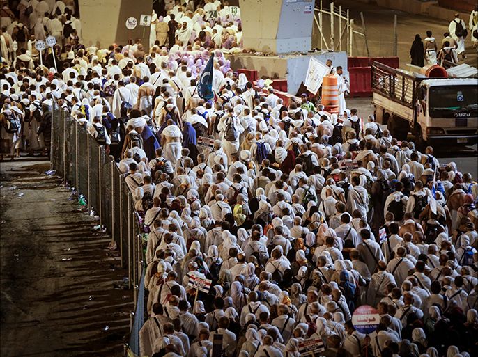 epa06175993 Muslim worshippers march toward Mena during the Hajj pilgrimage, near Mecca, Saudi Arabia, 01 September 2017. Around 2.6 million muslim are expected to attend this year's Hajj pilgrimage, which is highlighted by the Day of Arafah, one day prior to Eid al-Adha. Eid al-Adha is the holiest of the two Muslims holidays celebrated each year, it marks the yearly Muslim pilgrimage (Hajj) to visit Mecca, the holiest place in Islam. Muslims slaughter a sacrificial animal and split the meat into three parts, one for the family, one for friends and relatives, and one for the poor and needy. EPA-EFE/MAST IRHAM