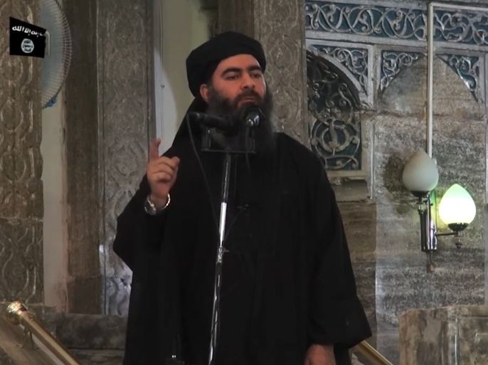 This July 5, 2014 photo shows an image grab taken from a propaganda video released by al-Furqan Media allegedly showing the leader of the Islamic State (IS) jihadist group, Abu Bakr al-Baghdadi, aka Caliph Ibrahim, adressing Muslim worshippers at a mosque in the militant-held northern Iraqi city of Mosul. Baghdadi, who on June 29 proclaimed a 'caliphate' straddling Syria and Iraq, purportedly ordered all Muslims to obey him in the video released on social media. In e