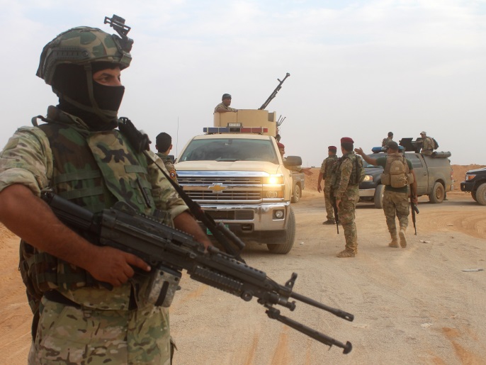 ‪(غيتي)‬ قوات عراقية شمال الأنبار قبل أربعة أيام خلال استعدادها لشن عملية عسكرية