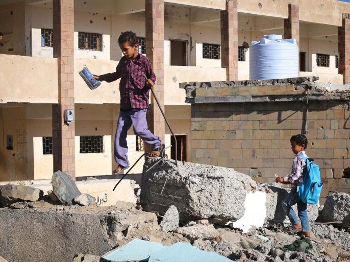 Yemeni school children walk outside a school on March 16, 2017, that was damaged in an air strike in the southern Yemeni city of Taez.The conflict in Yemen, which escalated with the intervention of the Saudi-led coalition two years ago, has more than doubled the number of children deprived of schooling to some 3.5 million, threatening the future of a whole generation in the impoverished country. / AFP PHOTO / Ahmad AL-BASHA (Photo credit should read AHMAD AL-BASHA/AFP/Getty Images)