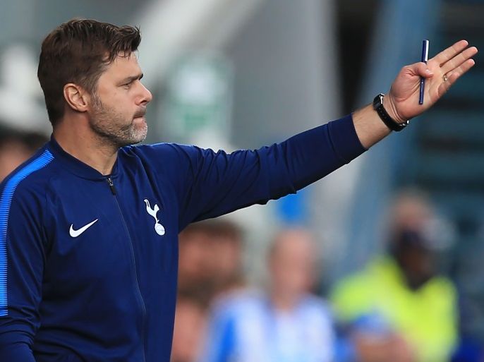 Tottenham Hotspur's Argentinian head coach Mauricio Pochettino gestures during the English Premier League football match between Huddersfield Town and Tottenham Hotspur at the John Smith's stadium in Huddersfield, northern England on September 30, 2017. / AFP PHOTO / Lindsey PARNABY / RESTRICTED TO EDITORIAL USE. No use with unauthorized audio, video, data, fixture lists, club/league logos or 'live' services. Online in-match use limited to 75 images, no video emulation. No use in betting, games or single club/league/player publications. / (Photo credit should read LINDSEY PARNABY/AFP/Getty Images)