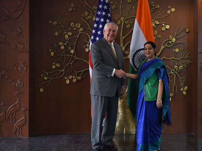 Indian Foreign Minister Sushma Swaraj (R) shakes hand with US Secretary of State Rex Tillerson before a meeting in New Delhi on October 25, 2017.US Secretary of State Rex Tillerson on October 25 started talks with Indian leaders expected to highlight the strong alliance between the two nations, with both anxious to counter China's growing influence. / AFP PHOTO / MONEY SHARMA (Photo credit should read MONEY SHARMA/AFP/Getty Images)