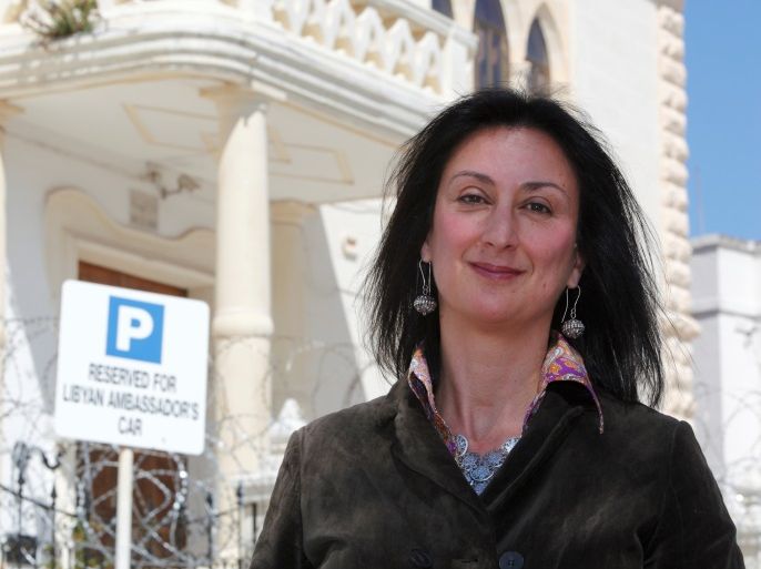 Maltese investigative journalist Daphne Caruana Galizia poses outside the Libyan Embassy in Valletta April 6, 2011. Investigative journalist Caruana Galizia was killed after a powerful bomb blew up a car killing her in Bidnija, Malta, in October 16, 2017. Picture taken April 6, 2011. REUTERS/Darrin Zammit Lupi