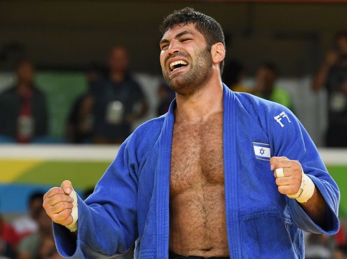 Israel's Or Sasson celebrates after defeating Cuba's Alex Garcia Mendoza during their men's +100kg judo contest bronze medal B match of the Rio 2016 Olympic Games in Rio de Janeiro on August 12, 2016. / AFP / Toshifumi KITAMURA (Photo credit should read TOSHIFUMI KITAMURA/AFP/Getty Images)