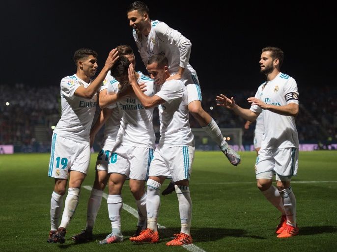 MADRID, SPAIN - OCTOBER 26: Marco Asensio of Real Madrid CF celebrates with teammates after scoring his teamÕs opening goal from a penalty kick during the Copa del Rey, Round of 32, First Leg match between Fuenlabrada and Real Madrid at Estadio Fernando Torres on October 26, 2017 in Madrid, Spain. (Photo by Denis Doyle/Getty Images)