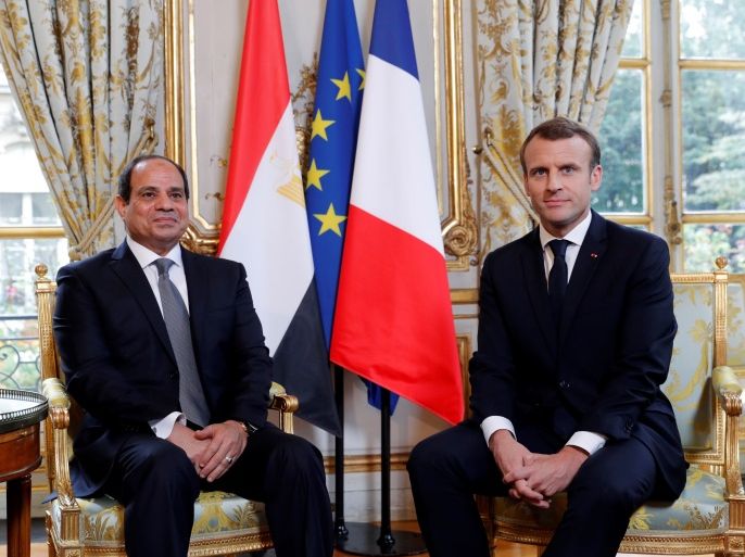 French President Emmanuel Macron (R) poses for a photograph with Egypt's President Abdel Fattah al-Sisi at the Elysee Palace, in Paris on October 24, 2017. Sisi, a former general who ousted the elected Islamist president Mohamed Morsi in 2013, is meeting the French president, defence and foreign ministers as well as business groups during his three-day trip. / AFP PHOTO / POOL / PHILIPPE WOJAZER (Photo credit should read PHILIPPE WOJAZER/AFP/Getty Images)