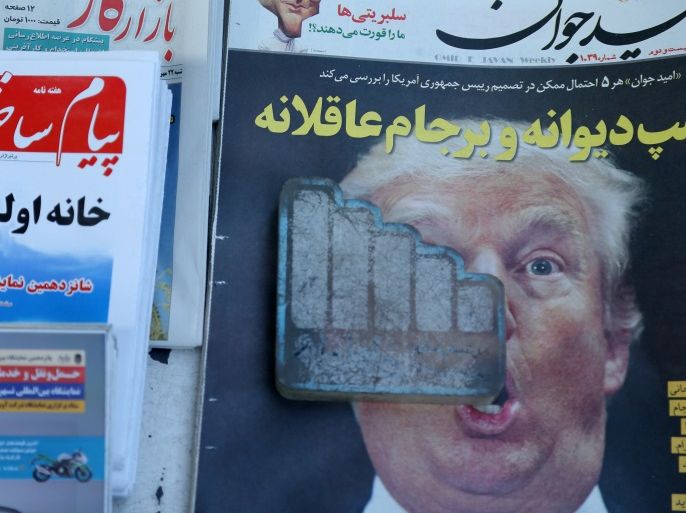 A newspaper featuring a picture of U.S. President Donald Trump is seen in Tehran, Iran, October 14, 2017. Nazanin Tabatabaee Yazdi/TIMA via REUTERS ATTENTION EDITORS - THIS IMAGE WAS PROVIDED BY A THIRD PARTY.