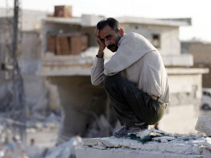 مدونات - 15 August, 2012A man reacts in front of houses destroyed during a recent Syrian Air Force air strike in Azaz, some 47 km (29 miles) north of Aleppo, August 15, 2012. REUTERS/Goran Tomasevic (SYRIA - Tags: CIVIL UNREST MILITARY POLITICS CONFLICT TPX IMAGES OF THE DAY)
