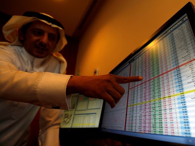 An investor gestures as he monitors a screen displaying stock information in Riyadh, Saudi Arabia, November 6, 2017. REUTERS/Faisal Al Nasser