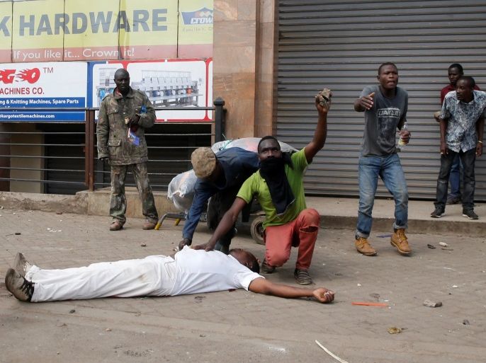 ATTENTION EDITORS - VISUAL COVERAGE OF SCENES OF INJURY OR DEATH - A man lies dead after being shot as supporters of Kenyan opposition leader Raila Odinga protest in Nairobi, Kenya November 17, 2017. REUTERS/Thomas Mukoya TEMPLATE OUT