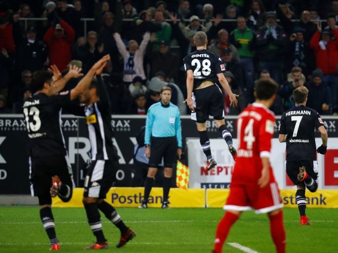 Soccer Football - Bundesliga - Borussia Moenchengladbach vs Bayern Munich - Borussia-Park, Moenchengladbach, Germany - November 25, 2017 Borussia Monchengladbach’s Matthias Ginter celebrates scoring their second goal with Patrick Herrmann and team mates REUTERS/Kai Pfaffenbach DFL RULES TO LIMIT THE ONLINE USAGE DURING MATCH TIME TO 15 PICTURES PER GAME. IMAGE SEQUENCES TO SIMULATE VIDEO IS NOT ALLOWED AT ANY TIME. FOR FURTHER QUERIES PLEASE CONTACT DFL DIRECTLY AT + 49 69 650050