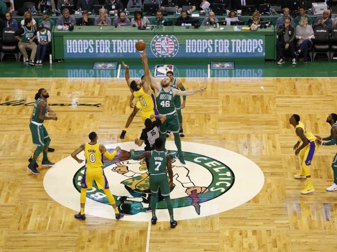 Nov 8, 2017; Boston, MA, USA; Los Angeles Lakers center Brook Lopez (11) and Boston Celtics center Aron Baynes (46) battle for the tip off during the first half at TD Garden. Mandatory Credit: Greg M. Cooper-USA TODAY Sports