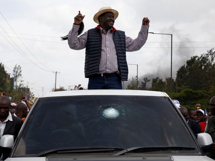 Kenyan opposition leader Raila Odinga of the National Super Alliance (NASA) coalition gestures to supporters upon his return in Nairobi, Kenya November 17, 2017. REUTERS/Baz Ratner