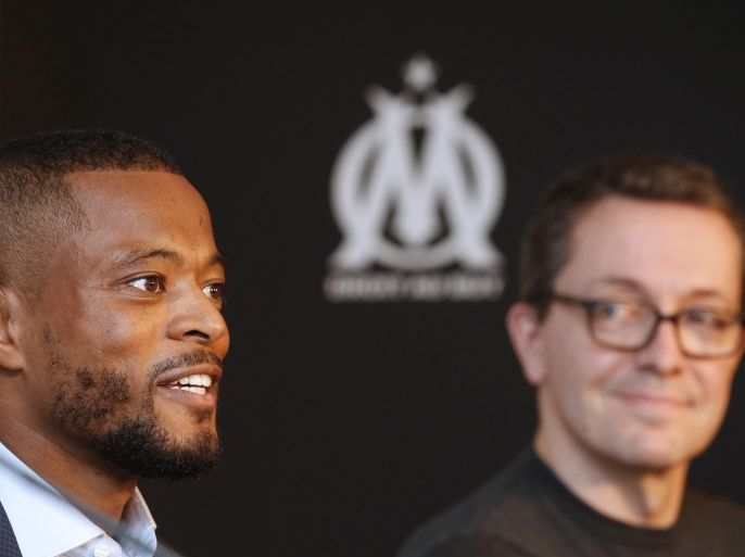 Olympique Marseille's latest recruit Patrice Evra attends a news conference with Olympique Marseille President Jacques-Henri Eyraud (R) in Marseille, France, January 26, 2017. REUTERS/Philippe Laurenson