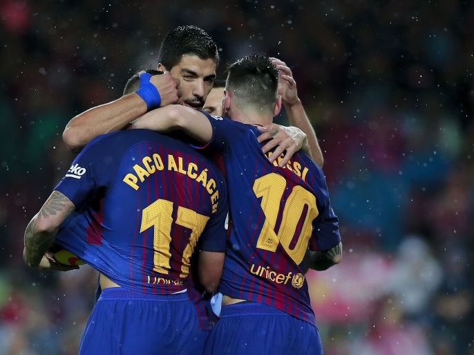 BARCELONA, SPAIN - NOVEMBER 04: Paco Alcacer (L) of FC Barcelona celebrates scoring their opening goal with teammates Luis Suarez (2ndL) and Lionel Messi (R) during the La Liga match between FC Barcelona and Sevilla FC at Camp Nou stadium on November 4, 2017 in Barcelona, Spain. (Photo by Gonzalo Arroyo Moreno/Getty Images)