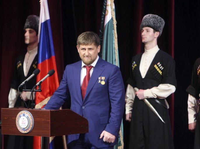 Chechen leader Ramzan Kadyrov (2nd L) takes part in a ceremony to inaugurate him for a second term as Chechen president in Grozny, April 5, 2011. Lawmakers in Russia's Chechnya region handed strongman leader Ramzan Kadyrov a new five-year term on Saturday, unanimously approving the Kremlin nominee in a vote whose outcome was never in doubt. REUTERS/Kazbek Basayev (RUSSIA - Tags: POLITICS)