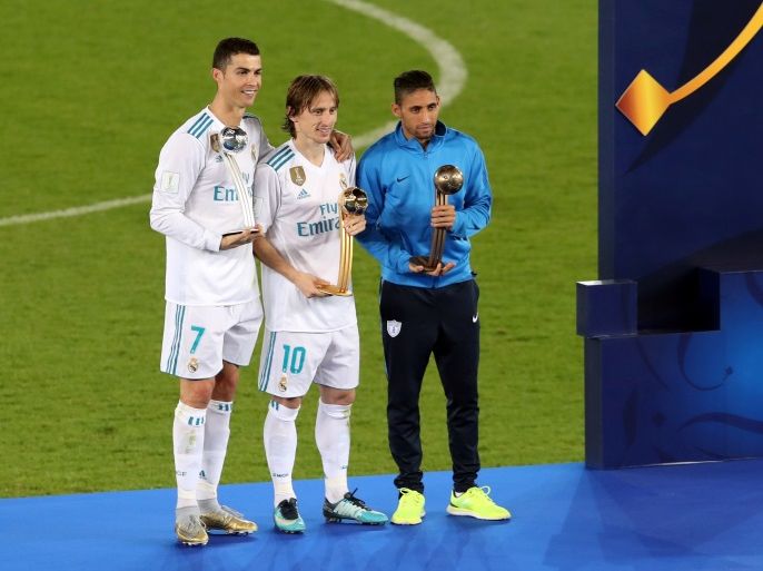 Soccer Football - FIFA Club World Cup Final - Real Madrid vs Gremio FBPA - Zayed Sports City Stadium, Abu Dhabi, United Arab Emirates - December 16, 2017 (L - R) Real Madrid’s Cristiano Ronaldo, Real Madrid’s Luka Modric and Pachuca's Jonathan Urretaviscaya celebrate with awards after the game REUTERS/Amr Abdallah Dalsh