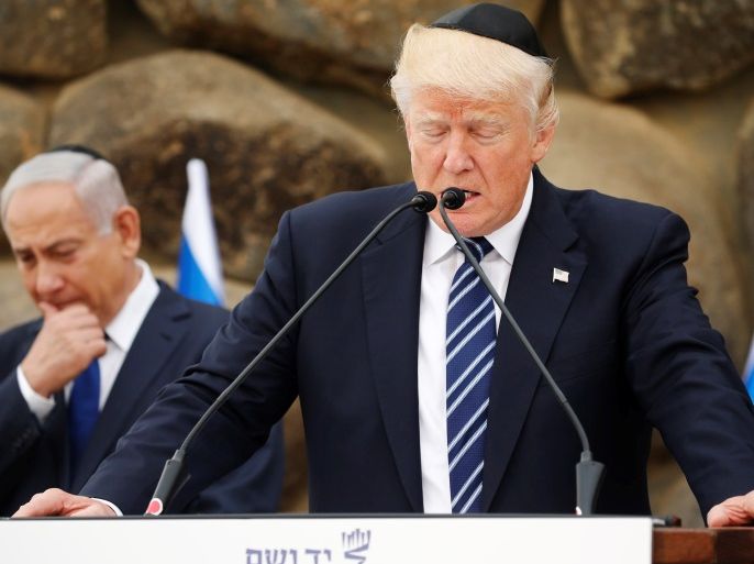 U.S. President Donald Trump, flanked by Israel's Prime Minister Benjamin Netanyahu (L), delivers remarks after a wreath-laying at the Yad Vashem holocaust memorial in Jerusalem May 23, 2017. REUTERS/Jonathan Ernst
