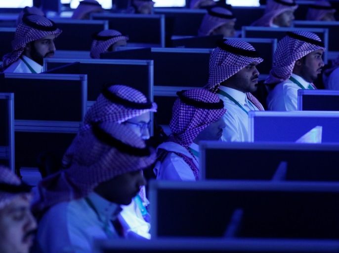 Data collectors sit at screens in new the Global Center for Combatting Extremist Ideology as they wait for a tour by U.S. President Donald Trump and Saudi Arabia's King Salman bin Abdulaziz Al Saud to commence in Riyadh, Saudi Arabia May 21, 2017. REUTERS/Jonathan Ernst