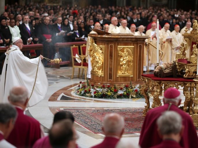 Pope Francis celebrates during the traditional midnight Mass in St. Peter's Basilica on Christmas Eve at the Vatican December 24, 2017. REUTERS/Tony Gentile