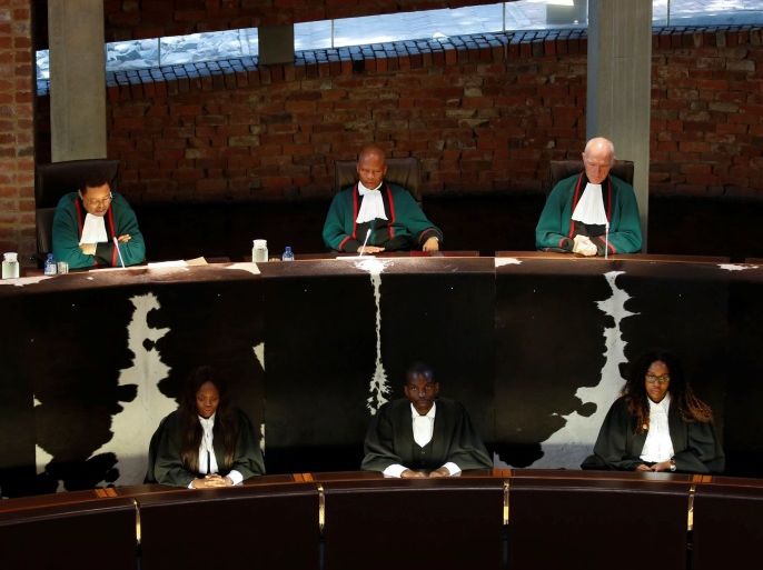 South Africa's Chief Justice Mogoeng Mogoeng, Judge Chris Jafta and Judge Edwin Cameron look on before making a ruling at the Constitutional Court in Johannesburg, South Africa, December 29, 2017. REUTERS/Siphiwe Sibeko