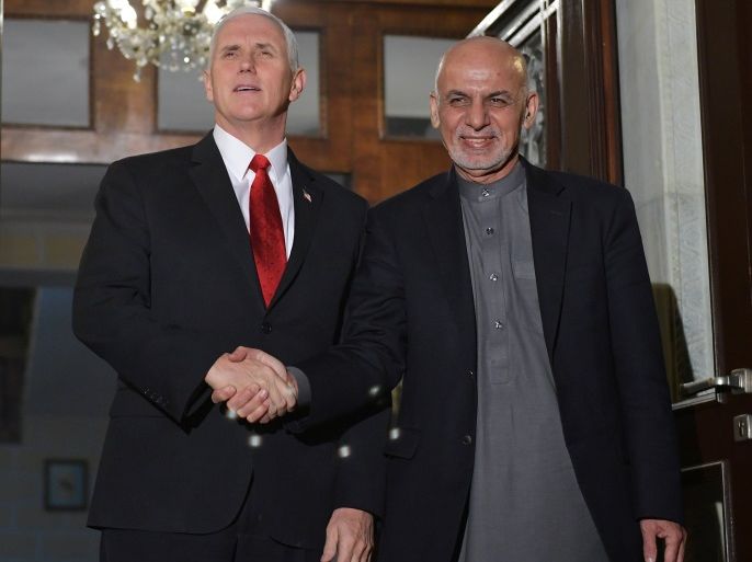 U.S. Vice President Mike Pence (L) poses with Afghan President Ashraf Ghani upon arrival at the Presidential Palace in Kabul, Afghanistan on December 21, 2017. REUTERS/Mandel Ngan/Pool