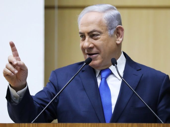 Israeli Prime Minister Benjamin Netanyahu gestures as he speaks during an event marking