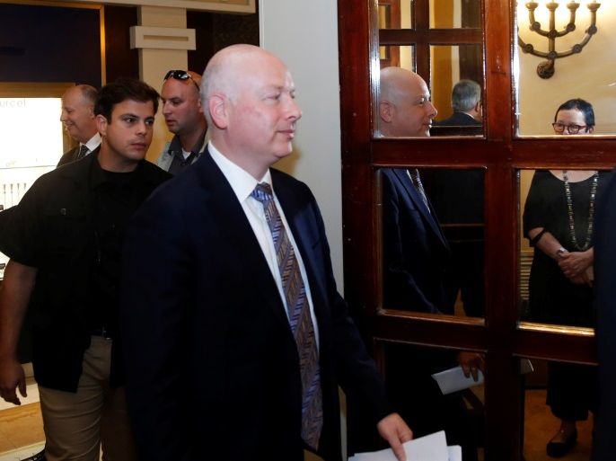 Jason Greenblatt (C), U.S. President Donald Trump's Middle East envoy, is reflected in a mirror as he enters a room to hold a news conference with Tzachi Hanegbi, Israeli Minister of Regional Cooperation and Mazen Ghoneim, head of the Palestinian Water Authority, in Jerusalem July 13, 2017. REUTERS/Ronen Zvulun