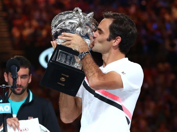 MELBOURNE, AUSTRALIA - JANUARY 28: Roger Federer of Switzerland kisses the Norman Brookes Challenge Cup after winning the 2018 Australian Open Men's Singles Final against Marin Cilic of Croatia on day 14 of the 2018 Australian Open at Melbourne Park on January 28, 2018 in Melbourne, Australia. (Photo by Clive Brunskill/Getty Images)